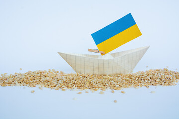 grain wheat and spikelets on a blue background. Ukrainian grain and problems of sea blockade of ports.	
 - obrazy, fototapety, plakaty
