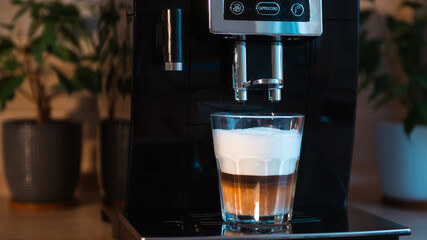 cooking cappuccino in a coffee machine.