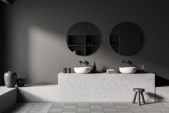 Grey bathroom interior with sink and mirror, stool and accessories