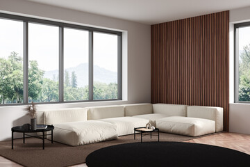 Light living room interior with couch and coffee table, panoramic window