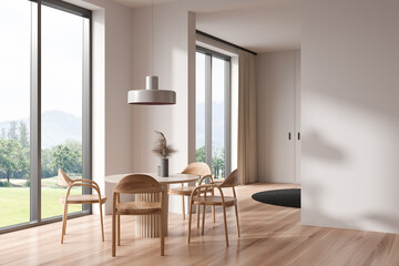Light dining room interior with table and chairs, panoramic window