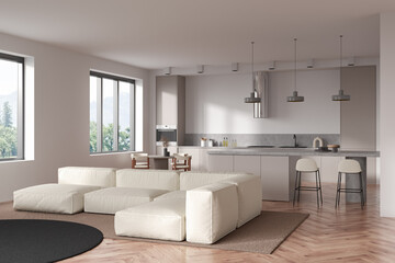 Light kitchen interior with couch and eating area, panoramic window