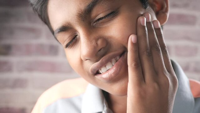 teenage boy with sensitive teeth 