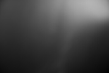 Fototapeta Dark black and gray blurred  gradient background has a little abstract light. obraz