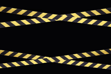 Yellow and black lines of barrier tape prohibit passage, tape on black isolate background