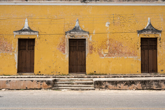 Street in Muna, Yucatan, Mexico with yellow wall and doors