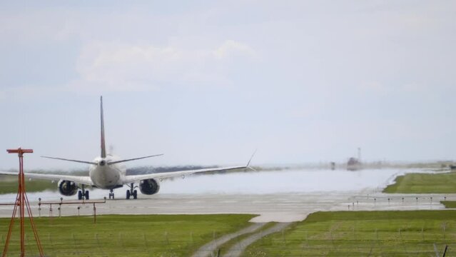 Rear View of Passenger Plane Taking Off From the Runway. Static.