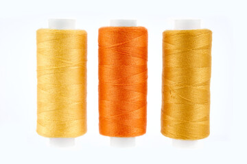 Sewing threads. Spool of thread with on white isolated background. Multicolor sewing threads background.