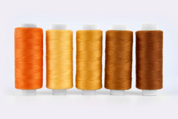 Sewing threads. Spool of thread with on white isolated background. Multicolor sewing threads background.