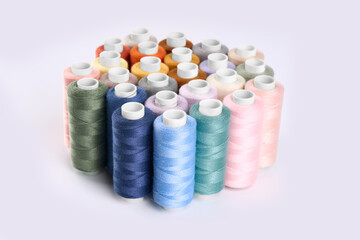 Sewing threads. Spool of thread with on white isolated background. Multicolor sewing threads background.