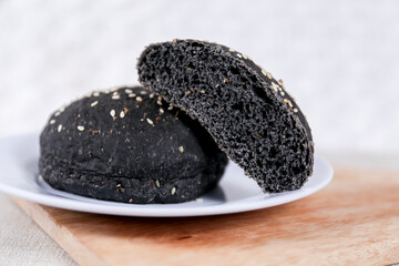 Black burger buns with sesame set with copy space for text	
