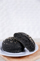 Black burger buns with sesame set with copy space for text	
