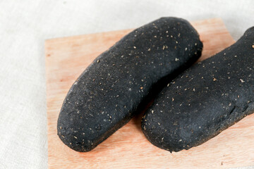 Black Long John buns bread with copy space for text	
