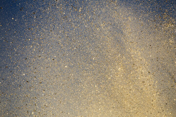 Bright splashes of the water fountain against the blue sky. Abstract color composition in sunshine...
