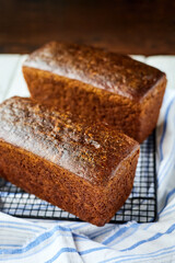 Freshly baked homemade rye bread on a textile background. Close-up, selective focus