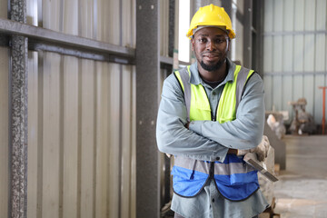 A portrait of technician working or operating in metal factory while maintenance service