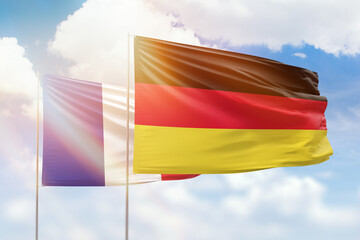 Sunny blue sky and flags of germany and france