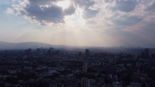Side scrolling aerial view of a sunset in Mexico City