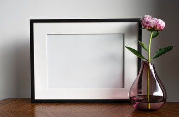 frame with place for text, flower decoration in a vase.