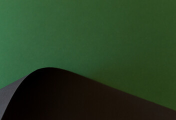Green and black colored paper folded background