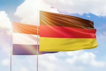 Fotobehang Sunny blue sky and flags of germany and netherlands © prehistorik