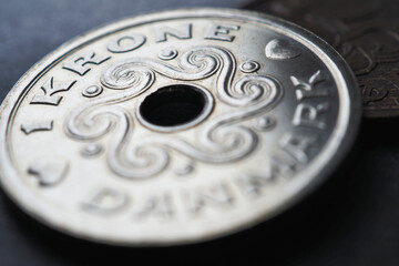 1 Danish krone coin closeup. National currency of Denmark. Money illustration for news about economy or finance. Loan and credit. Tax and inflation. Macro