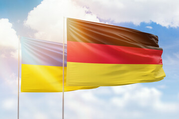 Sunny blue sky and flags of germany and ukraine