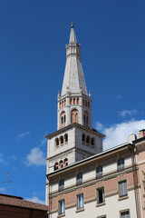 Fototapeta na wymiar Modena, Italy, touristic city, Ghirlandina tower in the blue sky, Unesco