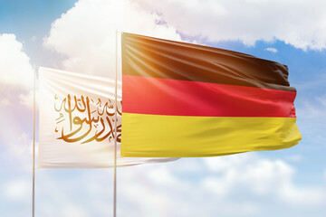 Sunny blue sky and flags of germany and afghanistan
