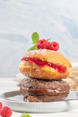 Bolas de Berlim, or Berlin Balls. Portuguese fried dough with sugar, Filled with chocolate or raspberry jam. Portuguese fried dough with sugar.