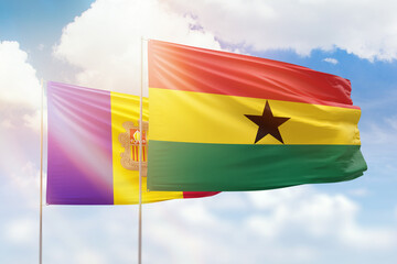 Sunny blue sky and flags of ghana and andorra