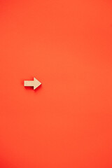 Wooden arrows point on red background. Space for your text