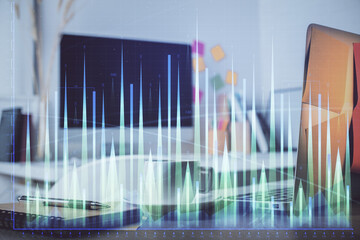 Forex market chart hologram and personal computer background. Multi exposure. Concept of investment.