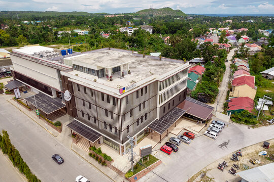 Tagbilaran City, Bohol, Philippines - May 2022: A call center or BPO midrise office building, with TaskUs as the main tenant.