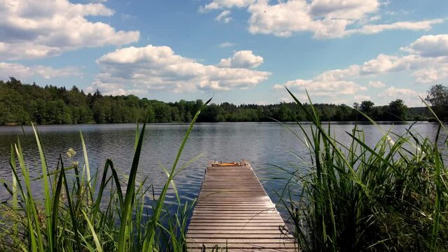 Flight over a jetty out onto the lake