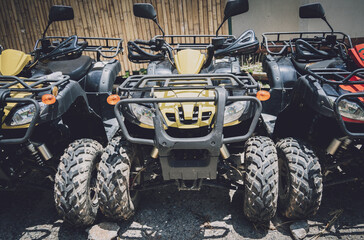 View of row dirty ATVs quad bike © romaset