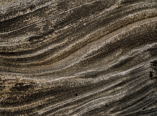 Textures and wavy shapes in the rocks at Bolonia beach on the coast of Cadiz, Spain.