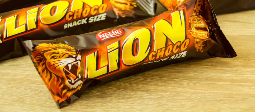 Chocolate bars Lion on wooden background