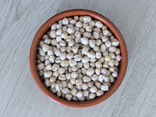 Chickpea close-up in a clay dish - Texture background - Food