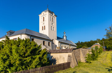 Fototapeta na wymiar St. Catherine church and Benedictine convent in Swieta Katarzyna village near Bodzentyn in Swietokrzyskie Mountains in Poland