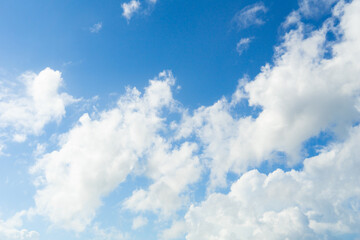 White clouds with blue sky background copy space. Sunshine day with beautiful clouds. Blue nature sky background and clouds.