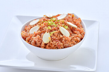 Gajar Halwa or Carrot Pudding. A delicious sweet and healthy dessert prepared by pure milk, desi ghee and fresh carrots.