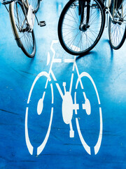 Bicycle parking area with bike pictogram symbol on ground