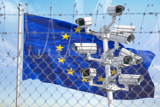 Flag of Europen Union EU behind barbed wire fence and cctv cameras. Concept of closing borders from refugees, discrimination and violation of human rights and freedom in EU.