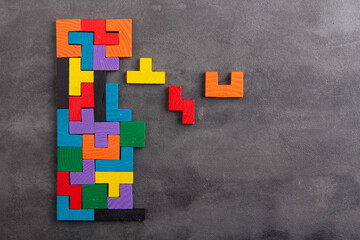 Creative idea solution - business concept, jigsaw puzzle on the grey background. Leadership and...
