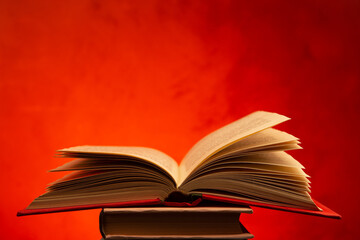 Wisdom and education concept.Book on the table, love reading. Retro neon light 90s