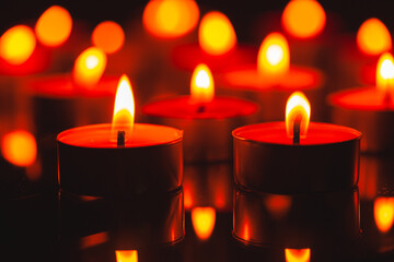 Candle,Many candles burn with a shallow depth of field