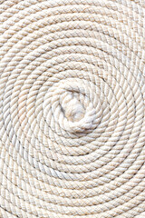 macro rope texture,Super close up of a thick rope in shape of a spiral,Photo of an old vintage rope. Natural warm light