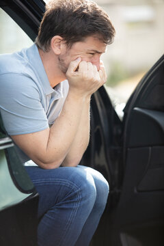 Young Man In Car During Traffic Jam