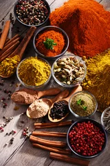 Foto op Aluminium Variety of spices on kitchen table © monticellllo